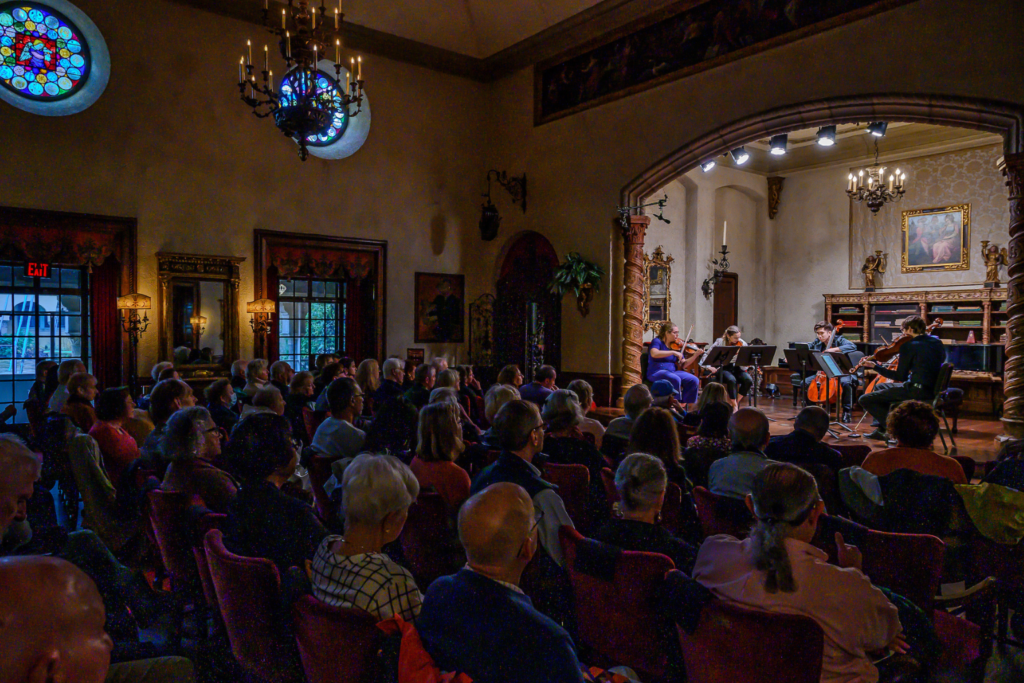 A photograph of the Evnin Rising Stars recital in the Music Room a few years ago.